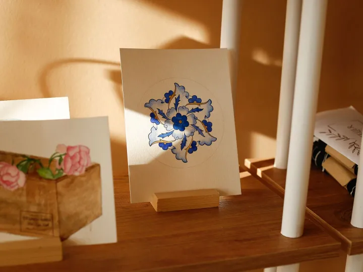 Greeting cards with hand painted floral designs on display