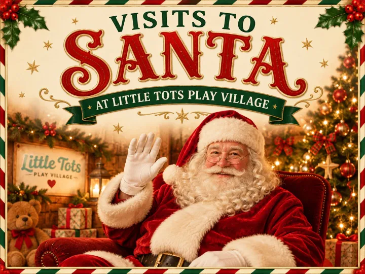Santa Claus waving from a cosy Christmas grotto at Little Tots Play Village, with festive decorations and a Christmas tree in the background.