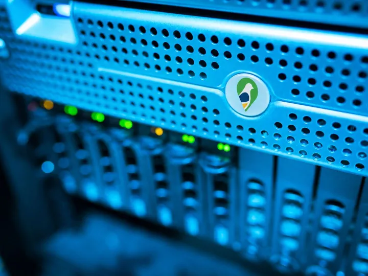 A rack-mounted web server carrying the Parish Council Pigeon logo, representing secure UK hosting