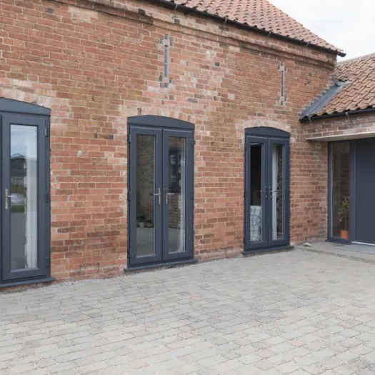 Flush sash French doors in dark grey