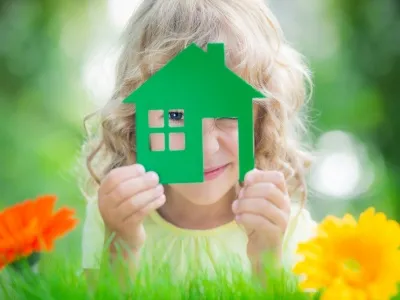 Child with toy house