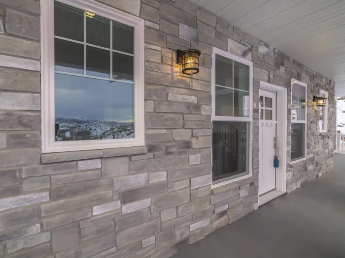 Sash window with grey stone wall