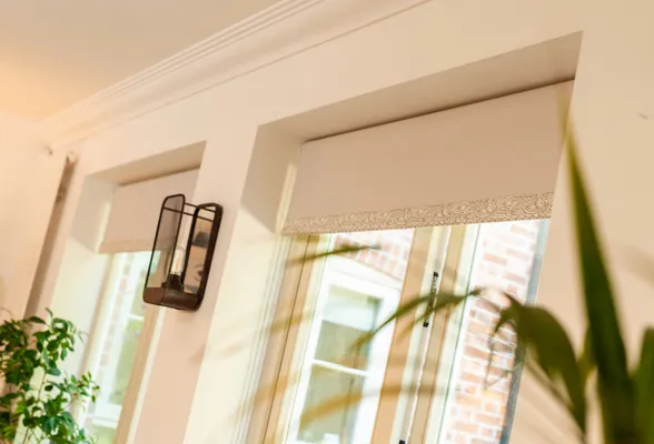 Peach blinds on peach wall