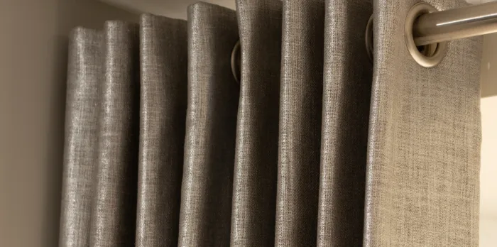 Eyelet curtains in grey
