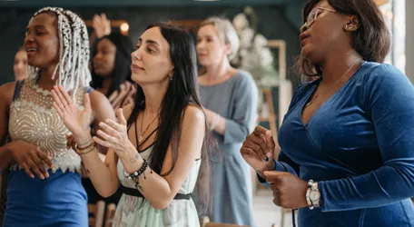 A Group of Women Singing Together
