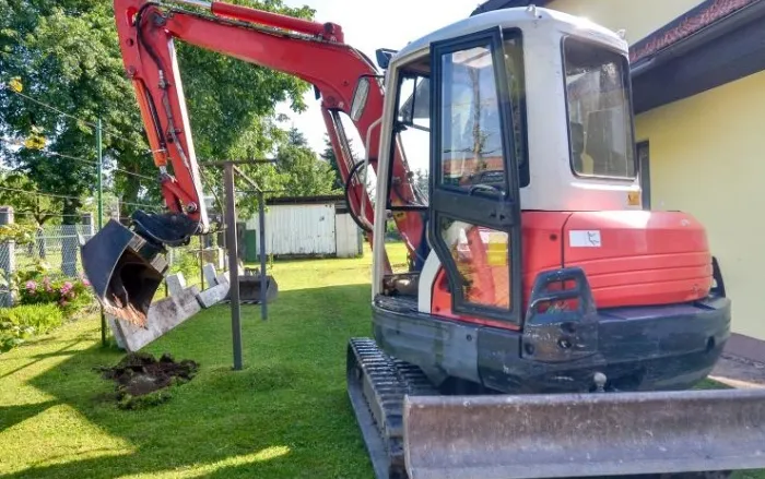Mini digger in a domestic garden