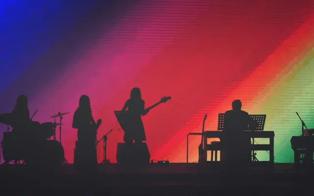 Band Members Playing On Stage