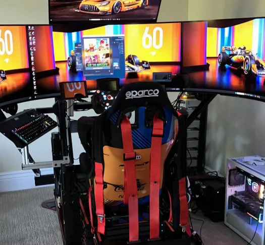Racing sim rig with a multiple screen layout