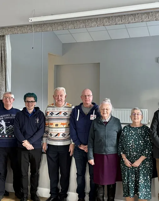 ChALC Executive Board members standing in a group in a meeting room, December 2024
