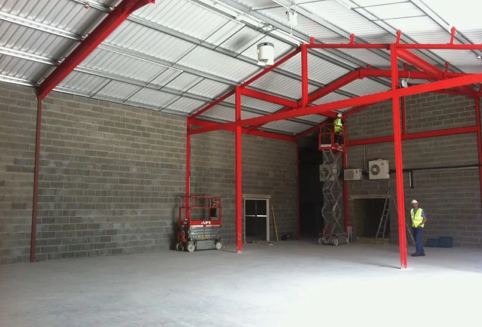 Warehouse construction with red steel frame