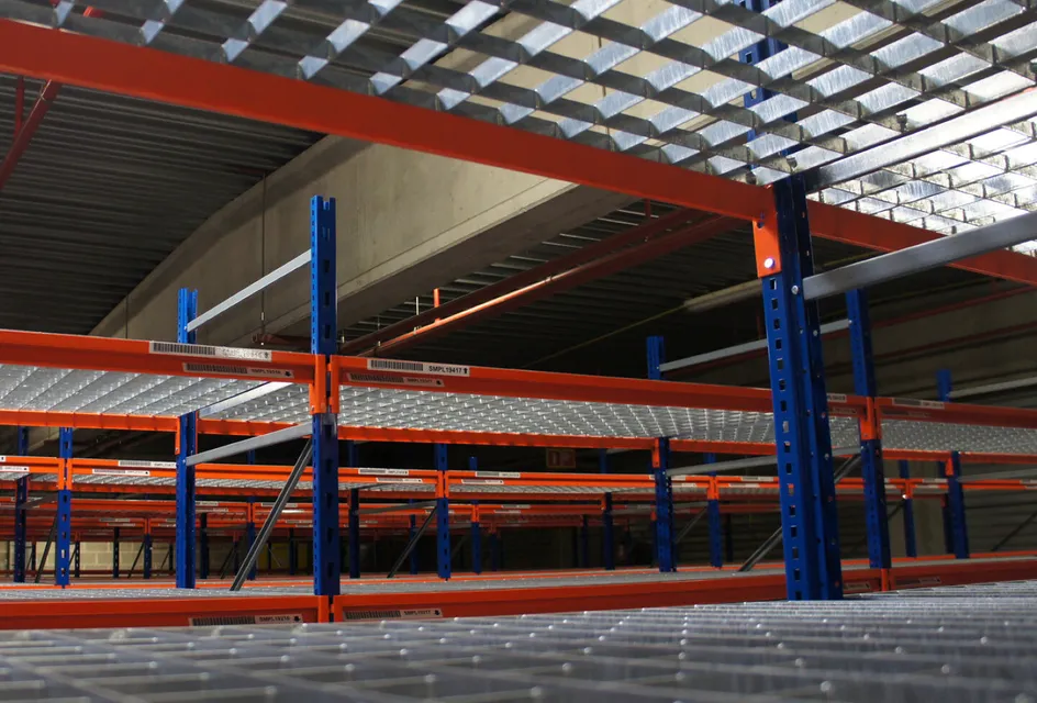 Newly painted warehouse shelving with blue columns and red beams
