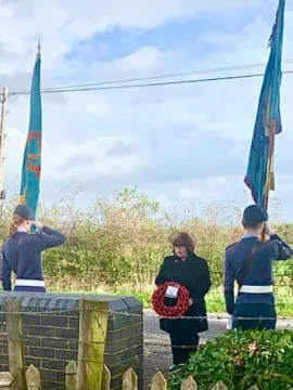 Borough Councillor Janet Clowes laying a wreath