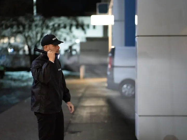 a moustached and bearded man in a blue suit has
