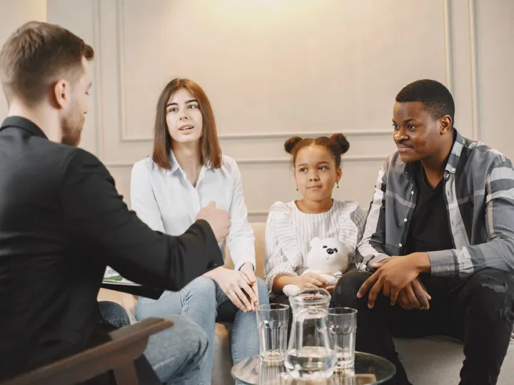 Family counseling session at home with therapist. Pshycologi