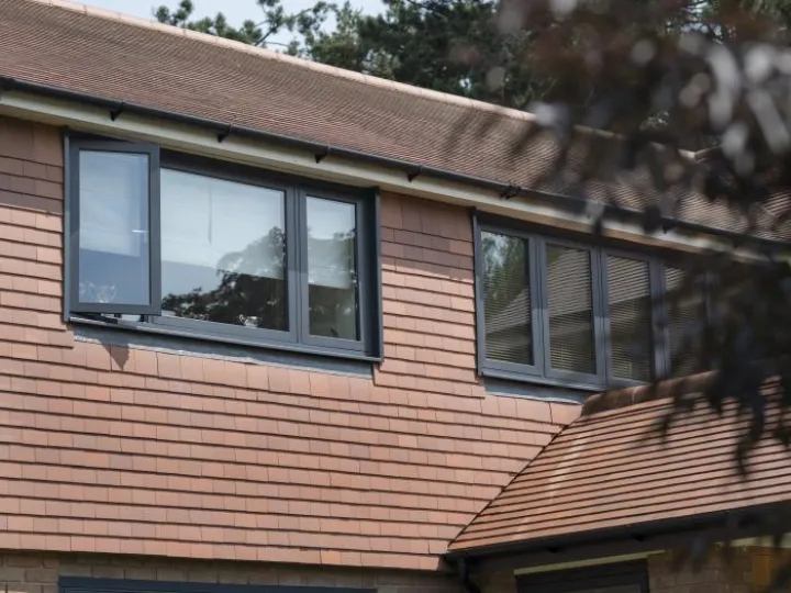 Dark grey flush casement bedroom windows