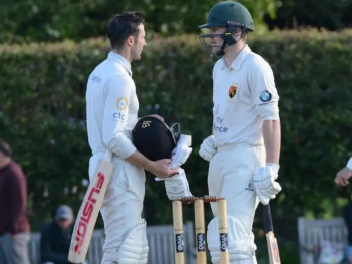 Image: 0_Nantwich-cc-v-Ormskirk-220-Ryan-Brown-black-Hat-Henry-Dobson-Green-Hat-50-runs-as-he-raises-his-bat-DESJPG