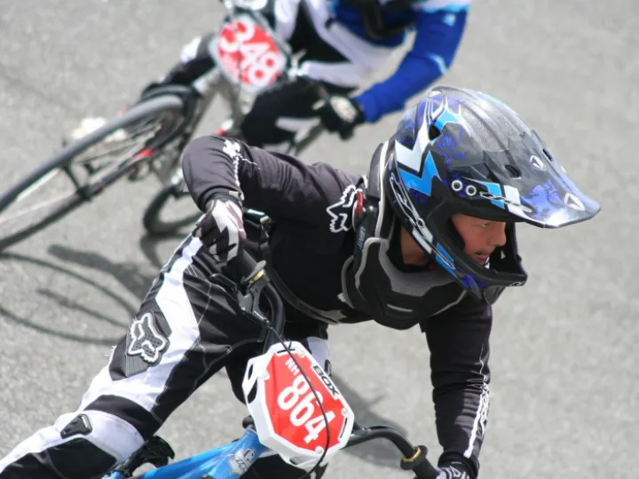 BMX riders in blue outfits