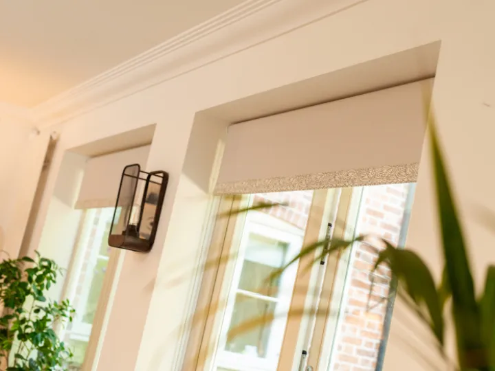 Peach blinds on peach wall