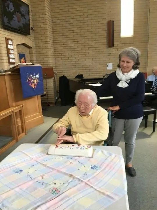 Frank cutting Anniversary cake 24