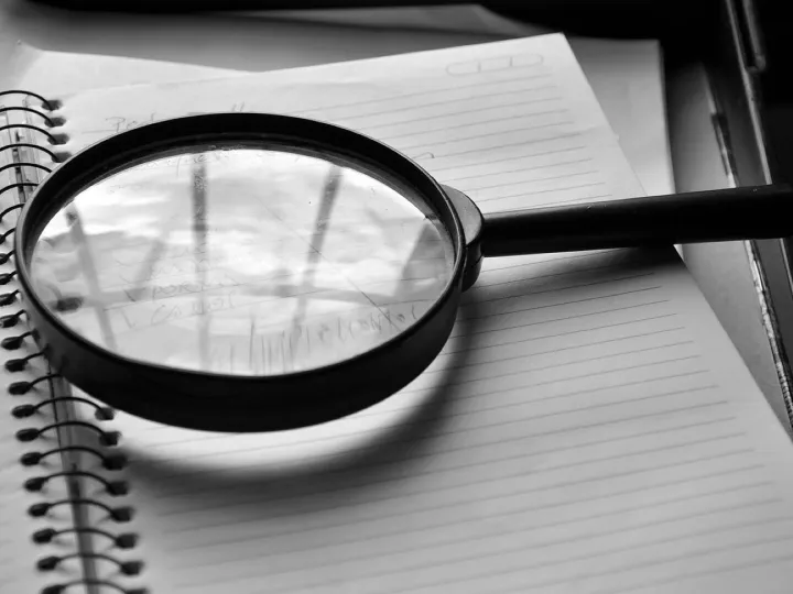 Magnifying glass, journal, detail