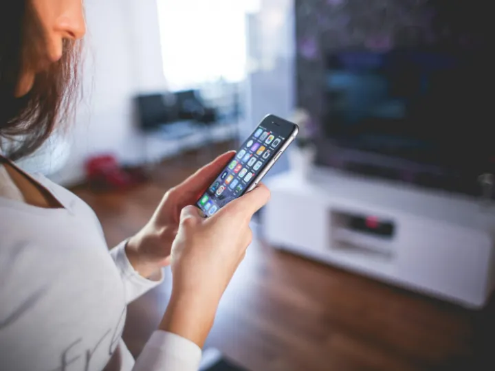 Woman Wearing White V Neck Shirt Using Space Gray Iphone 6