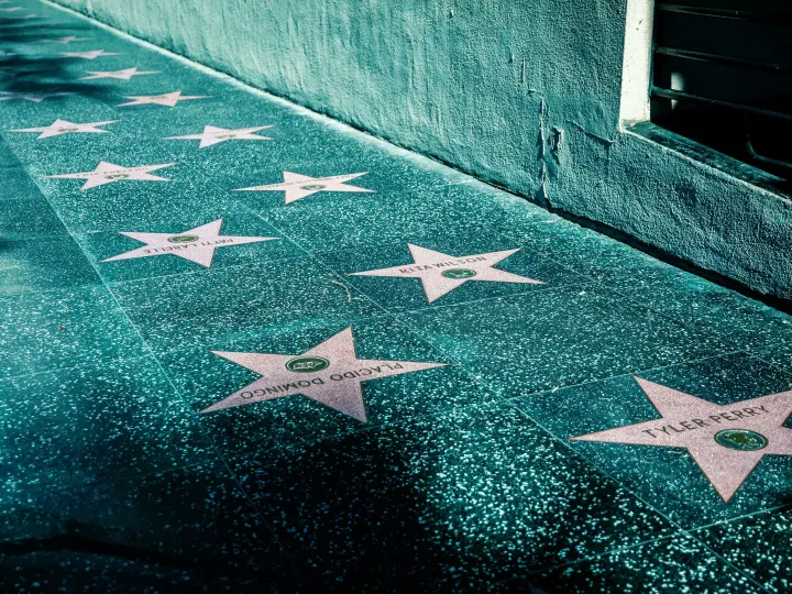 View of Hollywood Walk of Fame with stars on the sidewalk in Los Angeles, California.