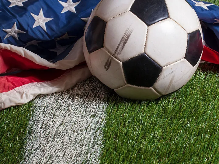 Soccer ball on an American flag symbolising Bank of America&rsquo;s new sports partnership and the growing U.S. football market