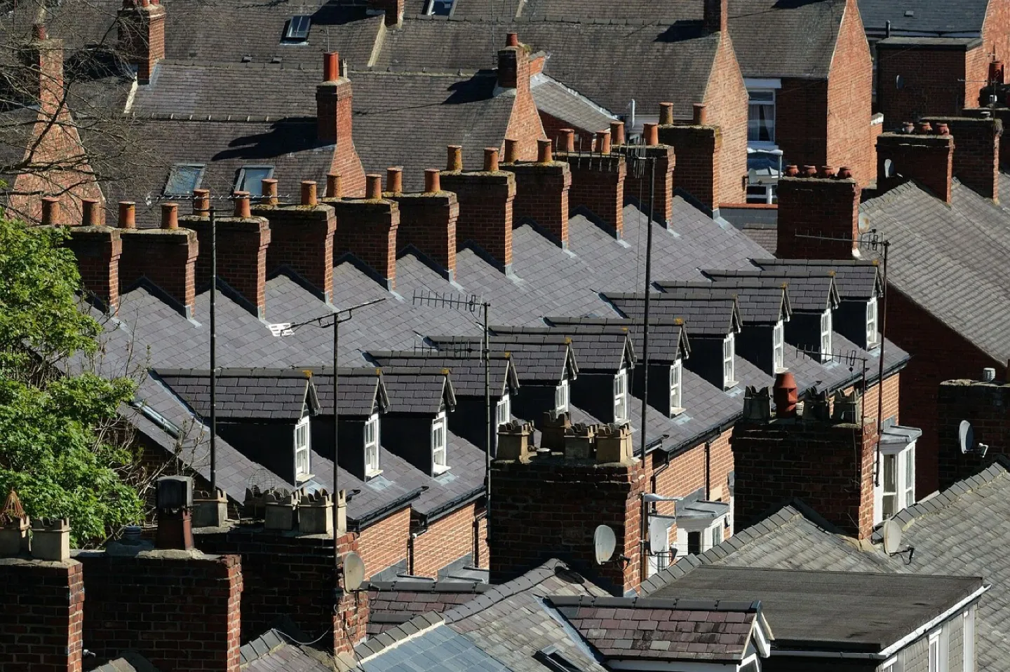 Red-brick terraced rooftops and chimney pots
