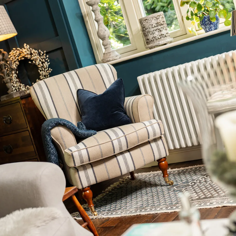 Cream striped chair in blue room
