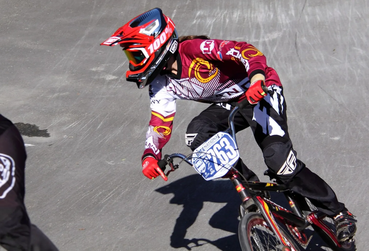 BMX rider in red outfit
