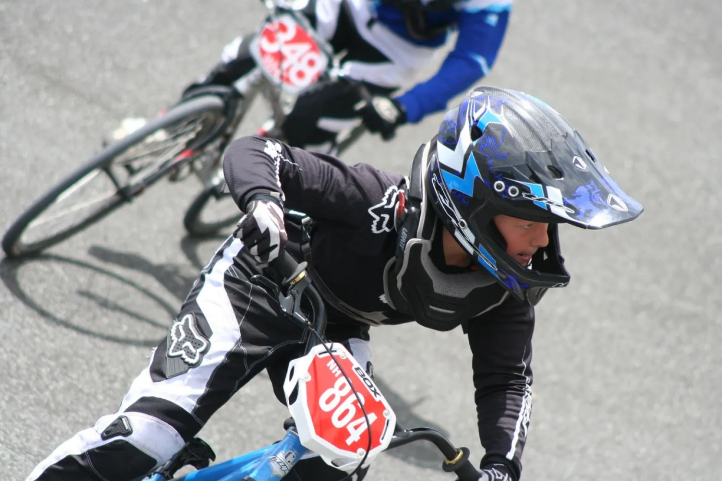 BMX riders in blue outfits