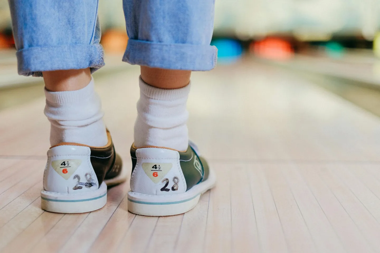 Close-up shot of a person wearing bowling shoes