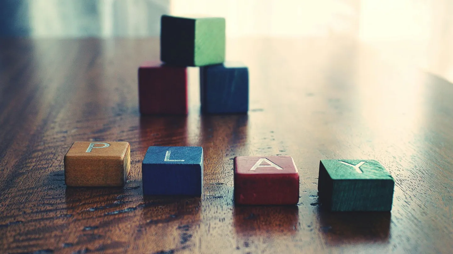 A vibrant still life of wooden alphabet blocks