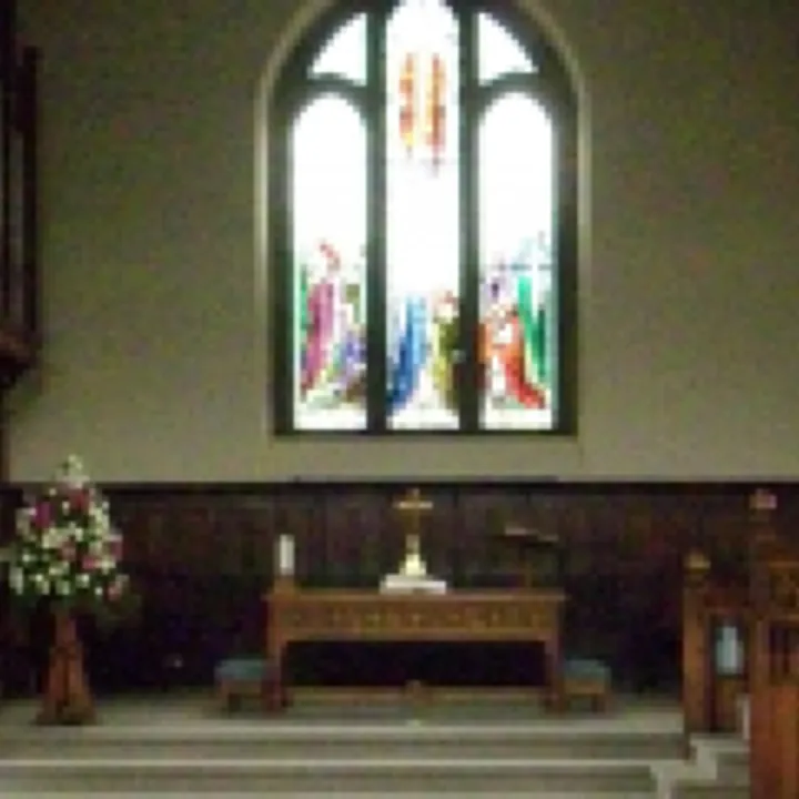 Front of Church With Stained Glass Window and Communion Table