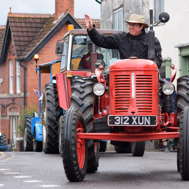 Tractor Owner Waves to The Crowds