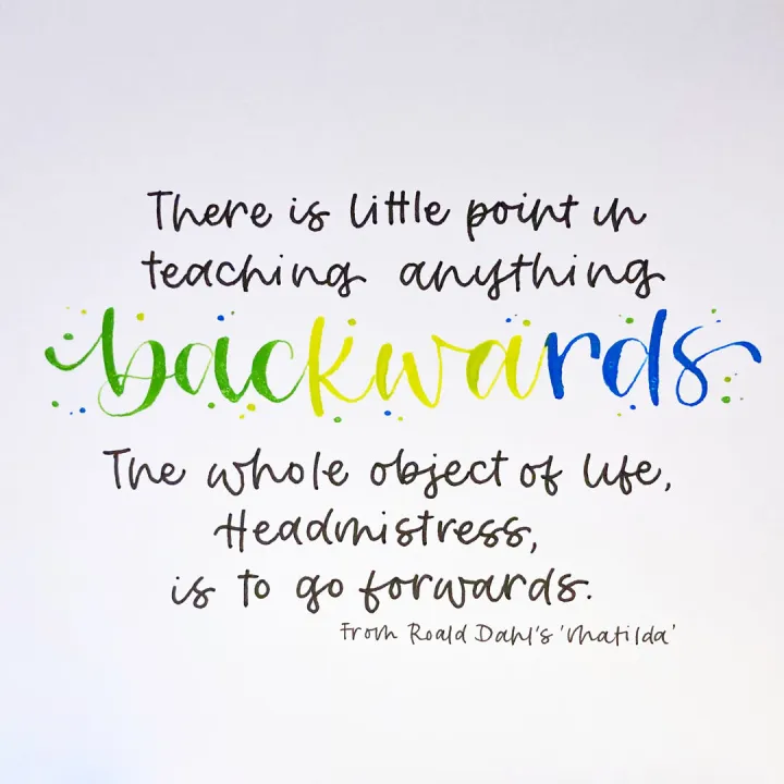 Hand lettered quote card about being reborn in modern calligraphy