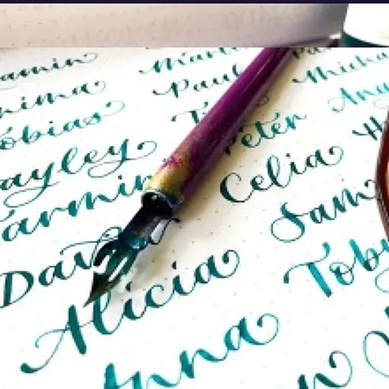 Hand written wedding place cards in blue modern calligraphy