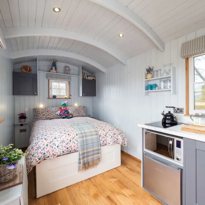 Inside the Shepherd&rsquo;s Crook with its double bed and kitchen