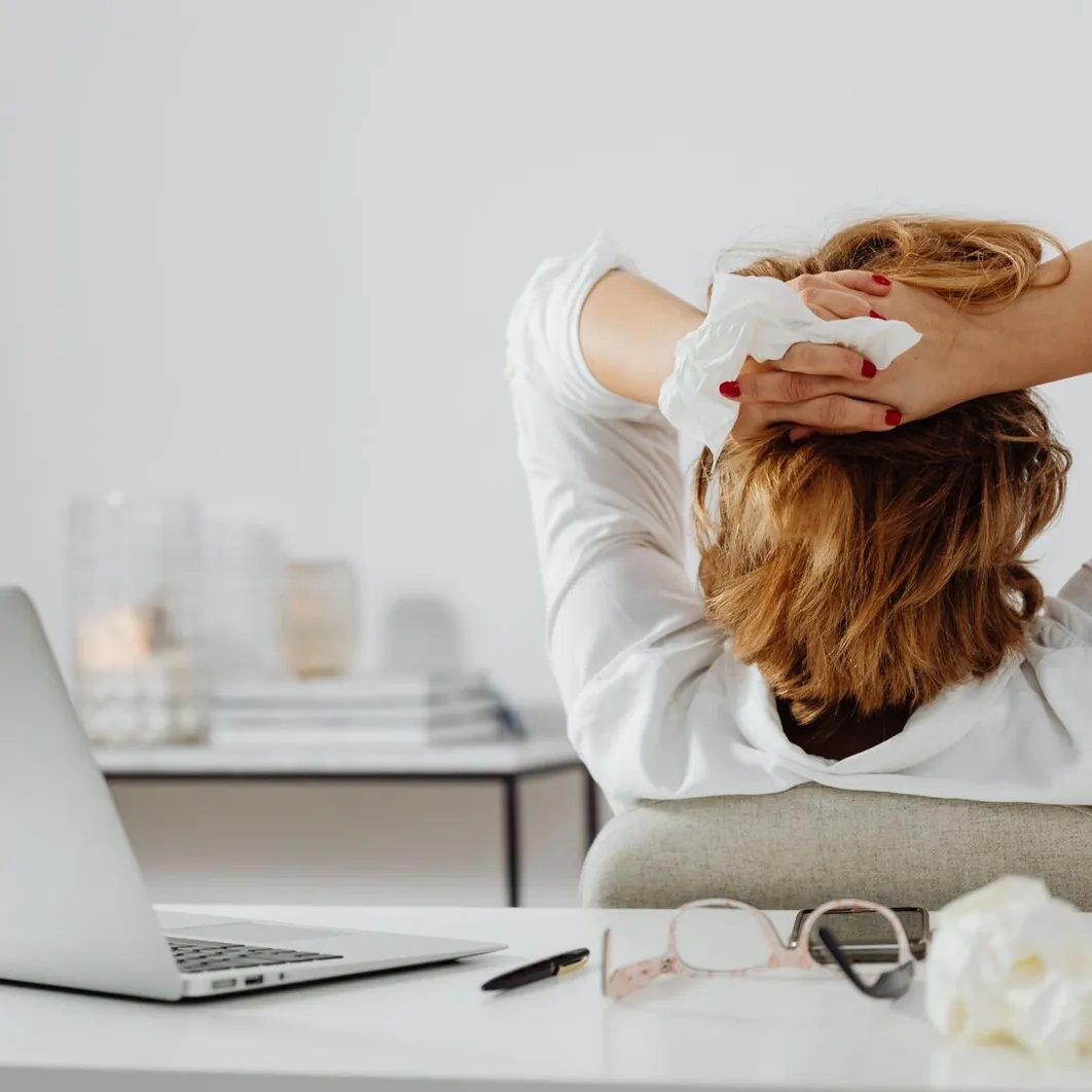 Office worker stretching at a desk