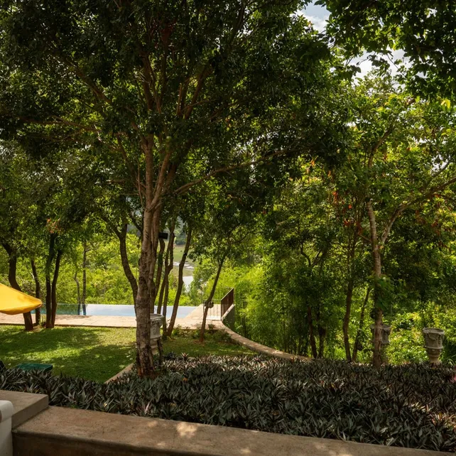 The garden and pool seen from the Lake View Suite at Peacock Hill Sigiriya