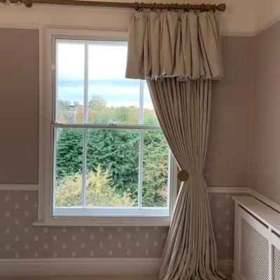 Puff ball heading curtains in cream