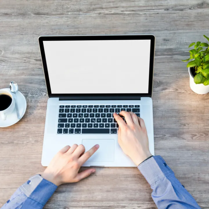 Person's Hand on Laptop