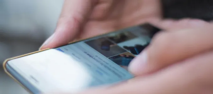 Person Using Smartphone Shallow Focus Photography