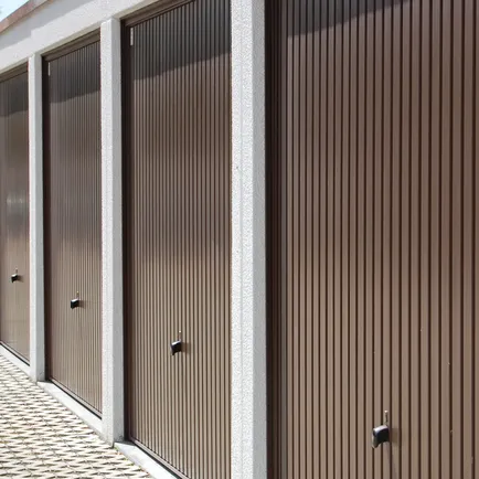 A row of newly painted garage doors