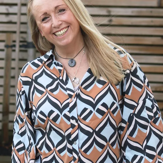 Sarah, counsellor at Infermind, smiling outdoors