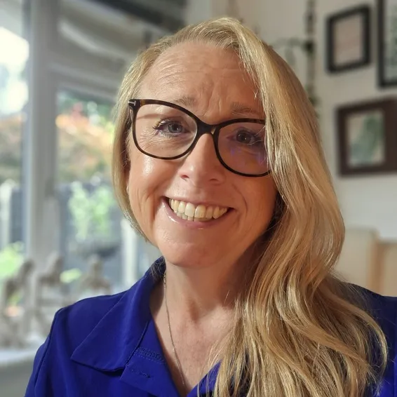 Sarah, counsellor at Infermind, smiling indoors