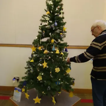 2025 u3a Christmas tree with blue and yellow decorations