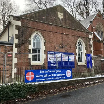 Building With Fencing and Banner