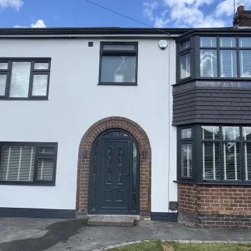 House Render in white with black frame doors and windows