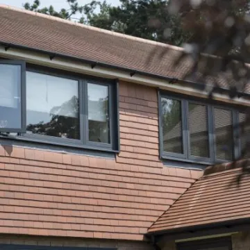 Dark grey flush casement bedroom windows